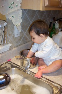 "Just whistle while you work..." (at cleaning out the pan Mommy made your rice cereal in...)