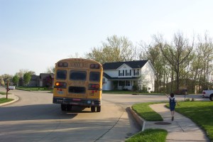 Alex running after the bus