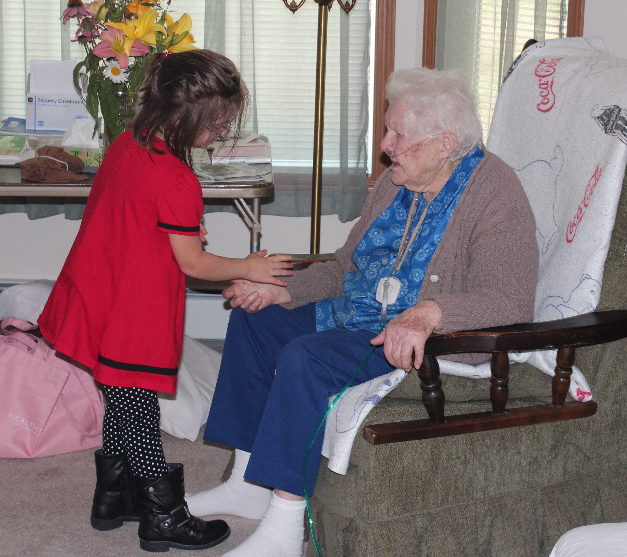 More willing than her brothers to brave the cannula on her great grandma.