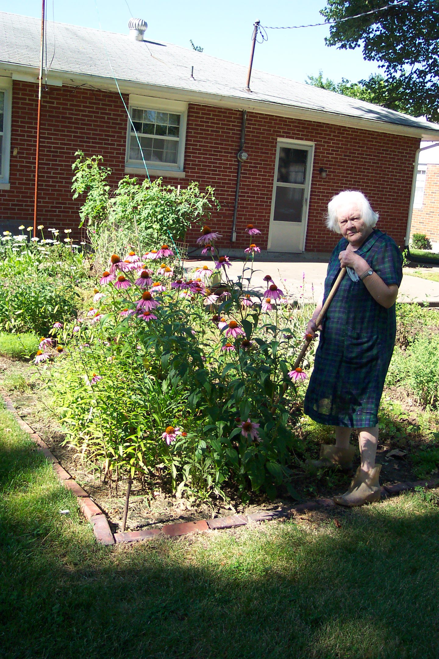Grandma, in her garden in 2003. To say this woman had a green thumb in her prime is a gross understatement.