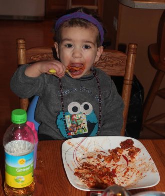 Headband, beads, sticker. This kids' ready for Mardi Gras.