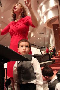 Conducting at Christmas Eve, with two little boys sitting on the podium with me, tickling my legs, brings a whole new perspective to multitasking.