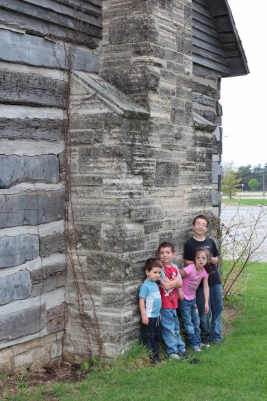 Log cabin beside the river, a historical marker for the origin of the city of Des Moines